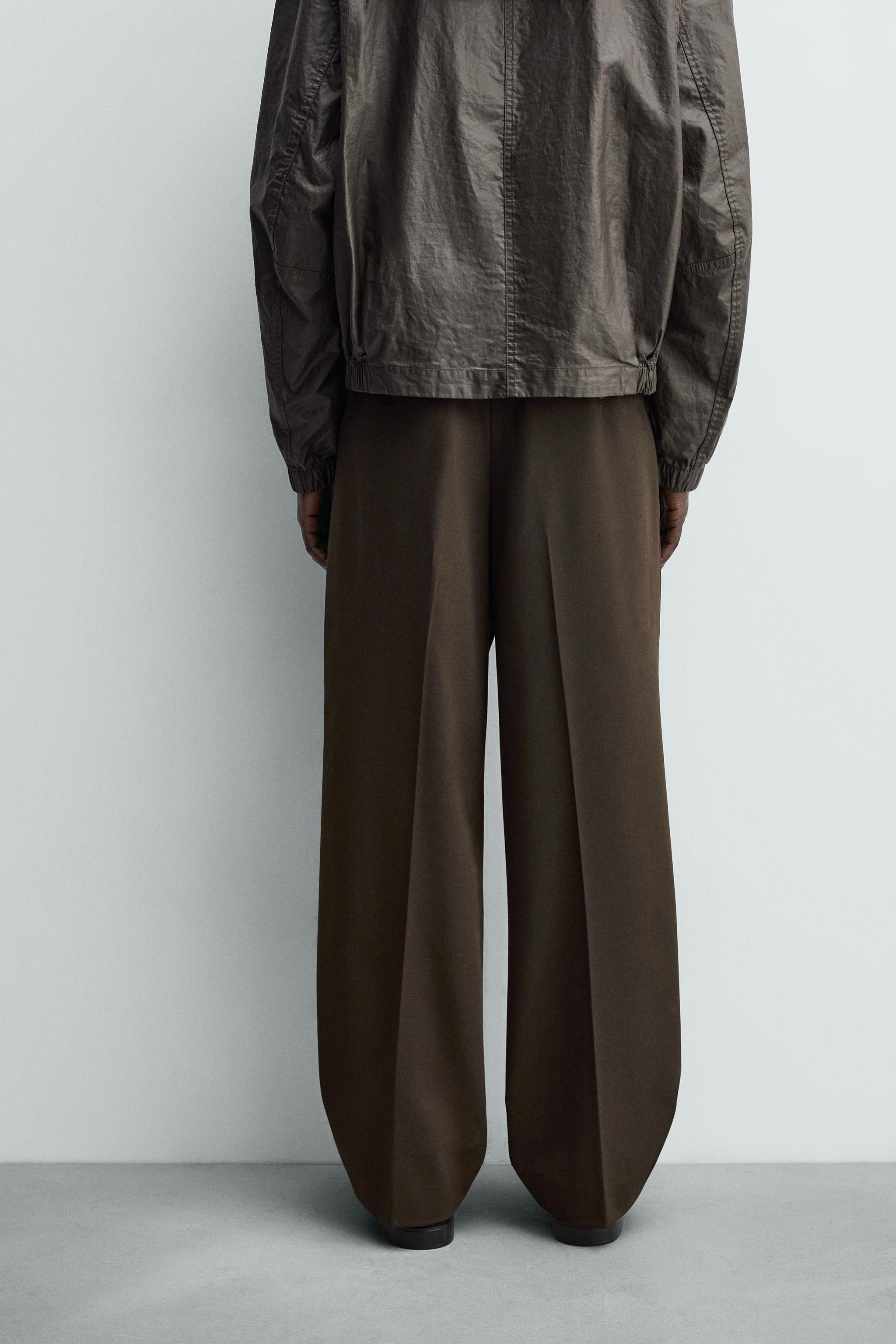 PANTALON COUPE LARGE À PLIS